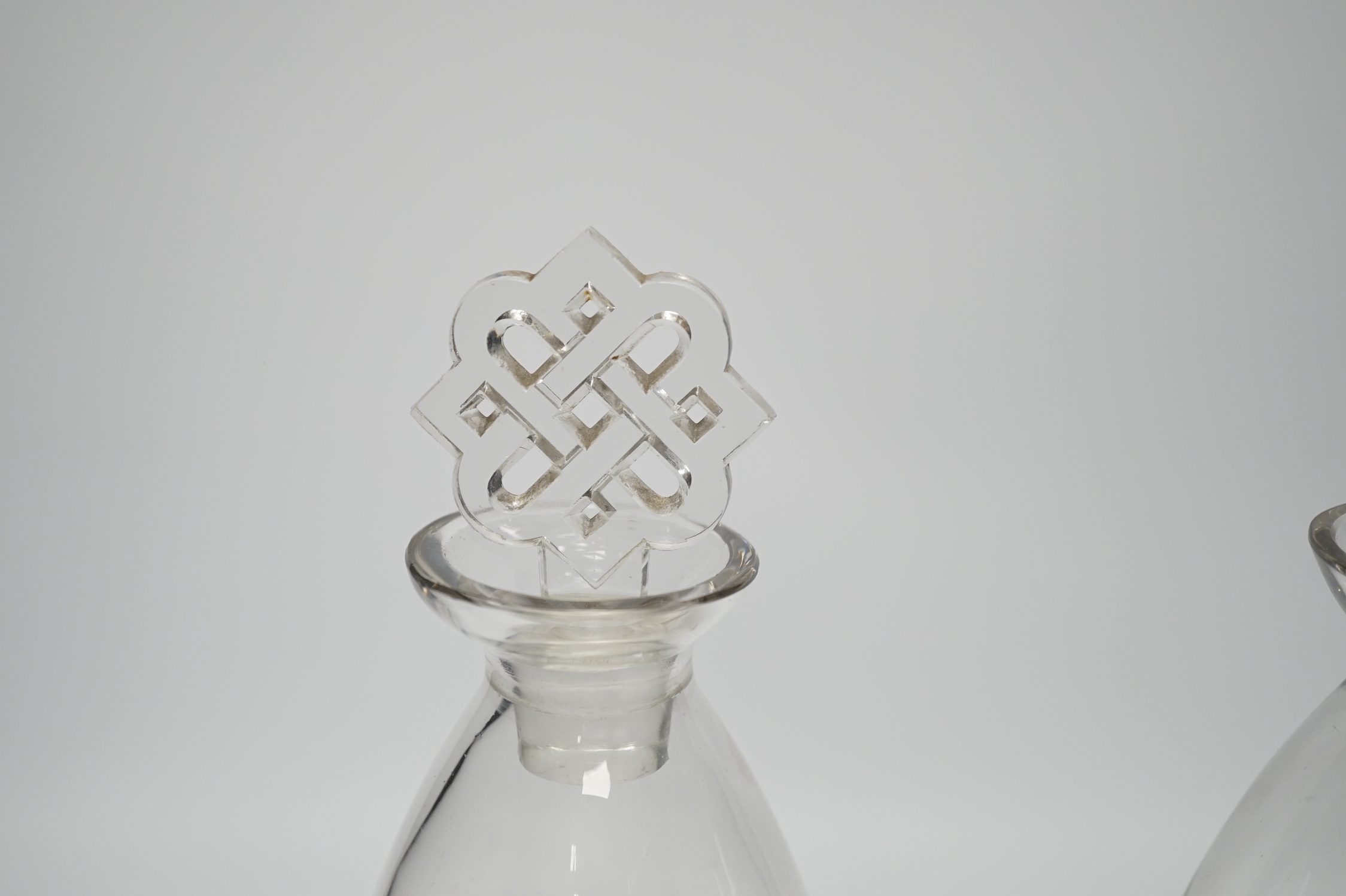 Two R. Lalique decanters, one with a Celtic knot stopper, the other the Star of David, tallest 27cm high (mark to base)